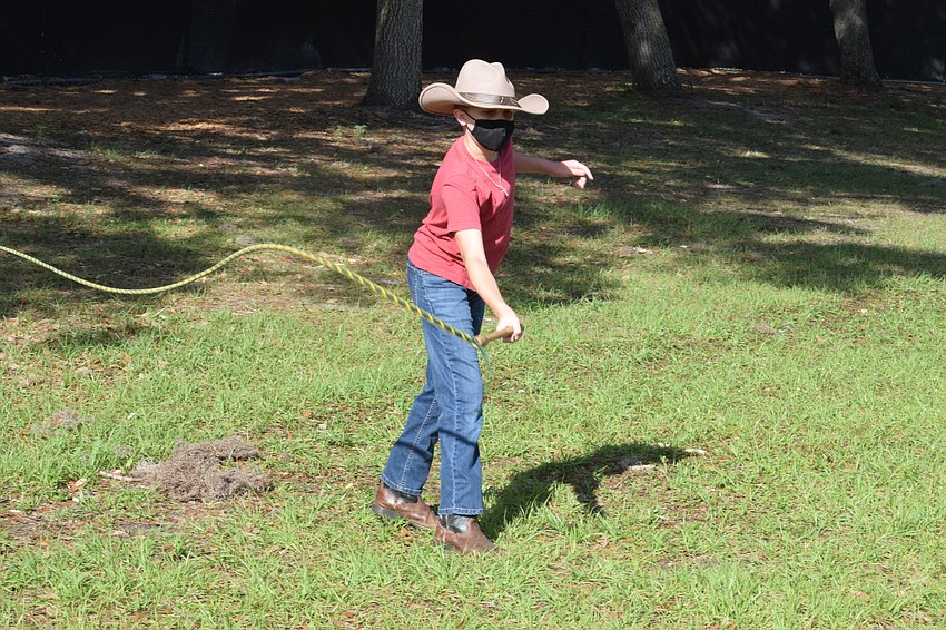 Lace Peters, a fourth grader at Gene Witt Elementary School, practices cracking a whip.