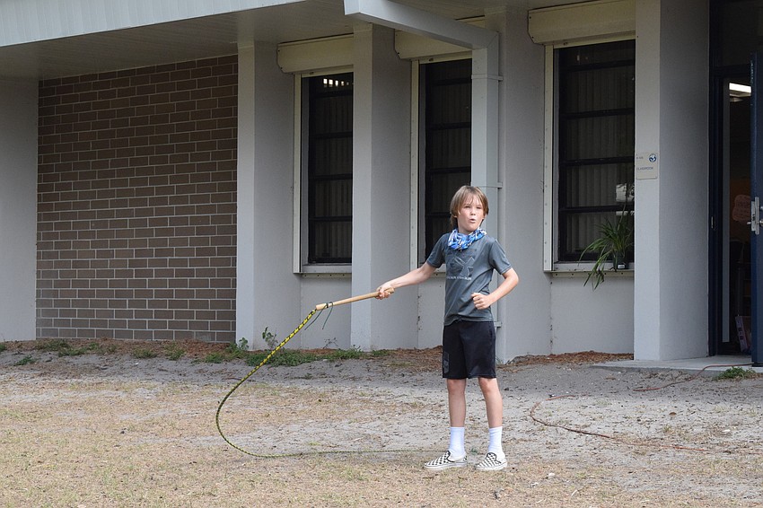 Michael Ryan, a fourth grader, surprises himself when he's able to properly crack a whip so it makes a pop sound. 