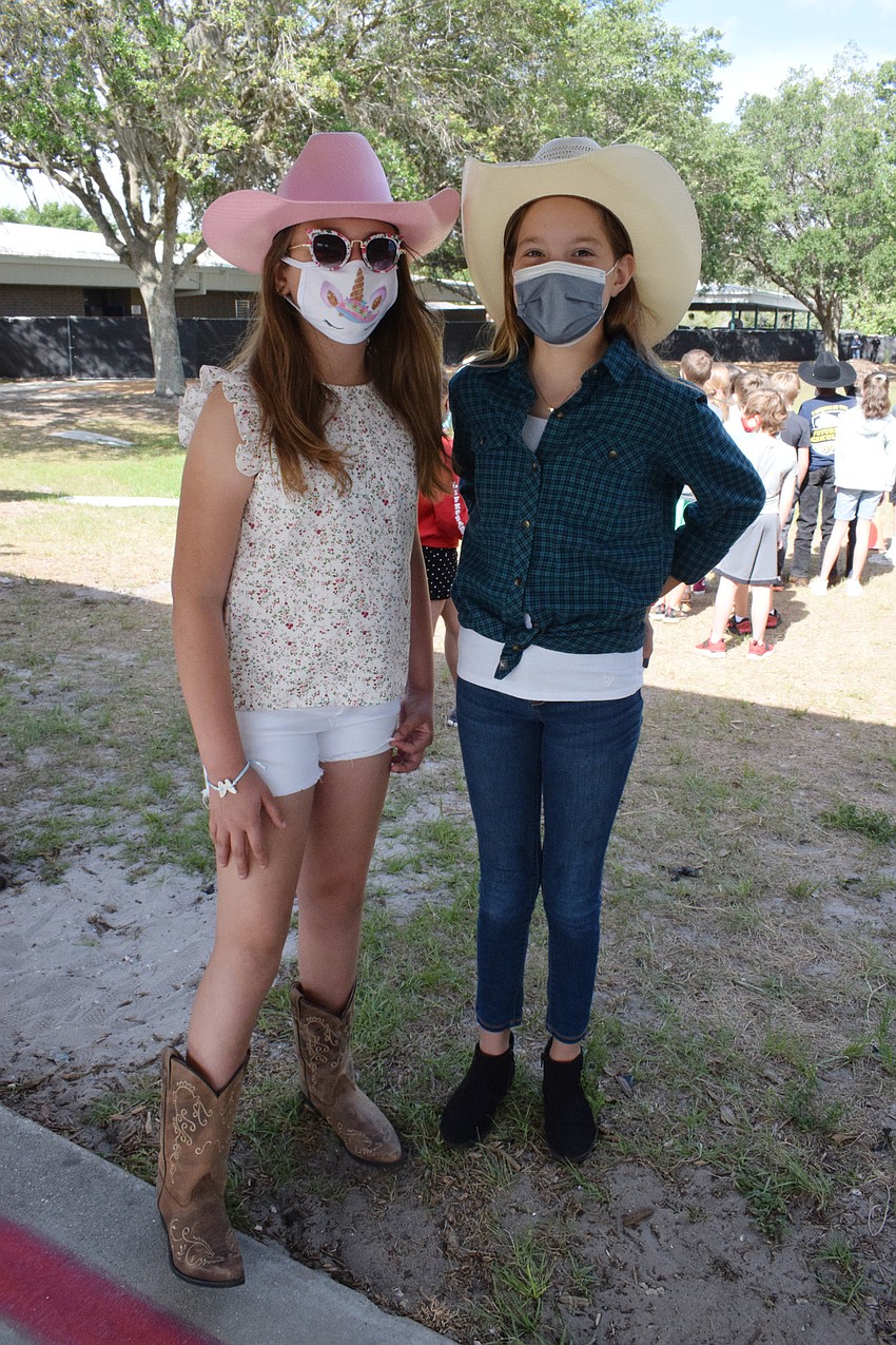 Gabriella Borko and Maleah Spalding, fourth graders, dress as cowgirls.