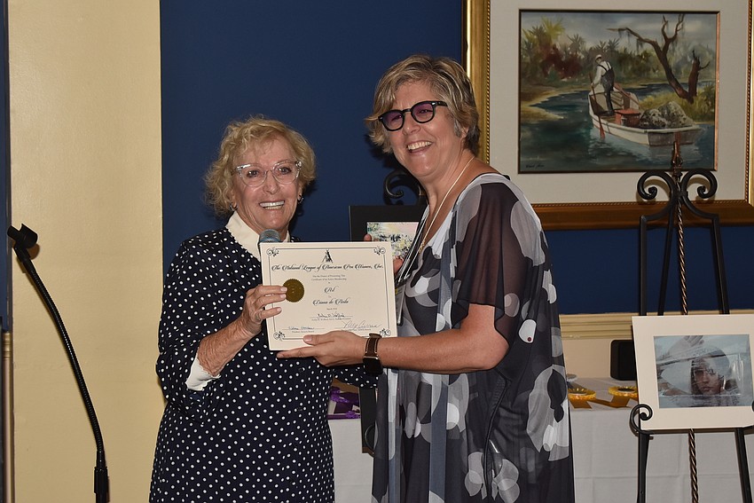 Wilma Davidson presented Diana DeAvila with a certificate for membership.