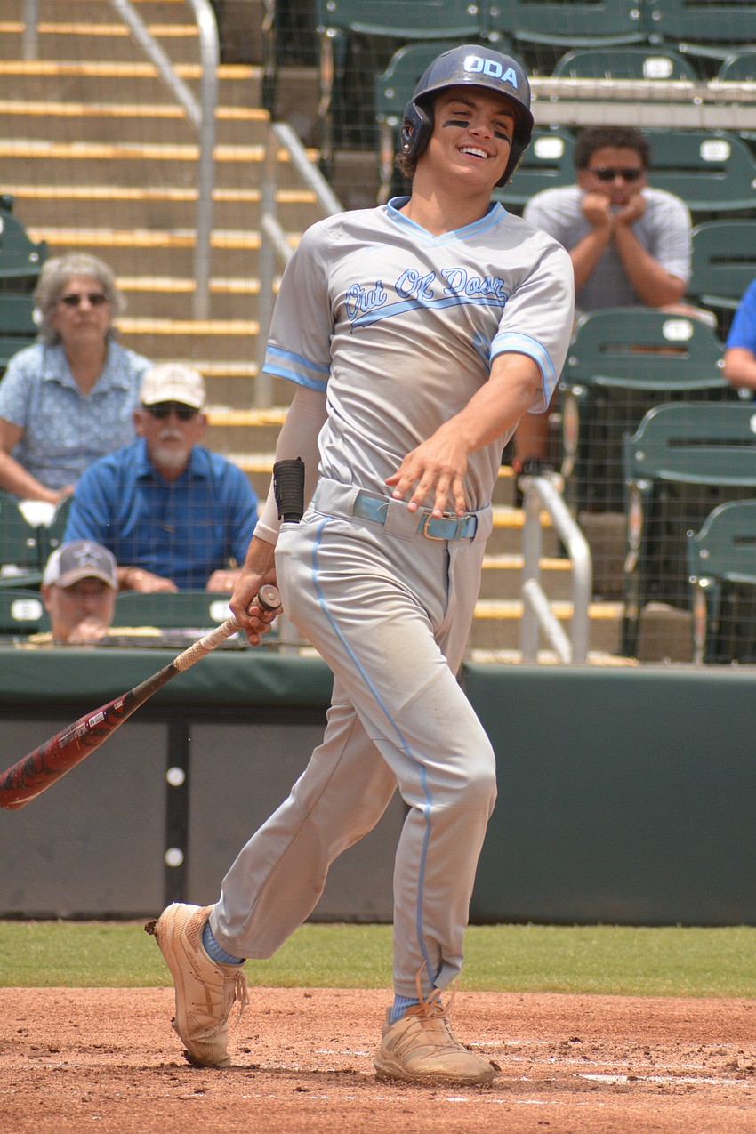 ODA senior Tanner Fairchild smiles after a swing in the first inning.