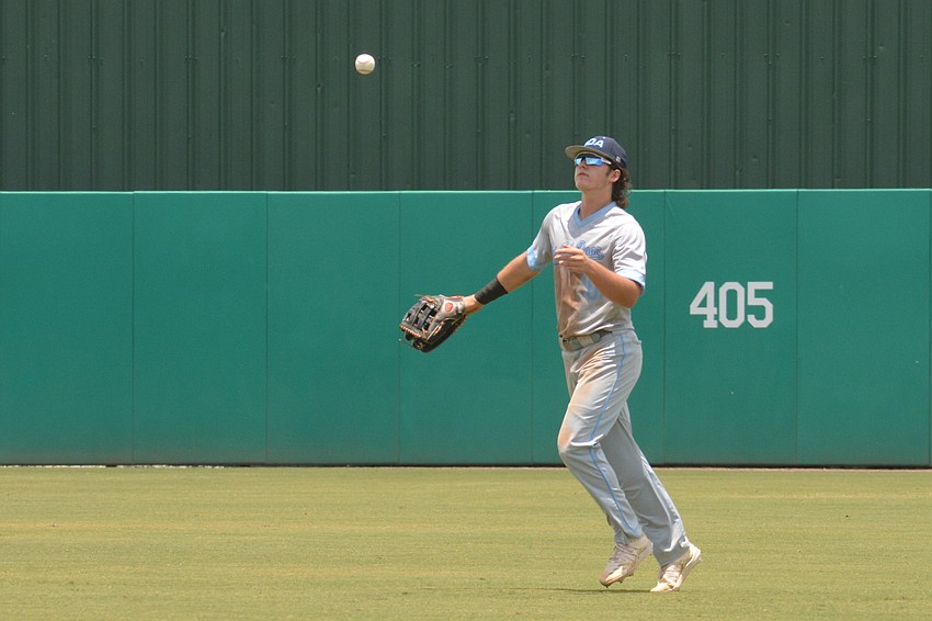 ODA junior Carter Dierdorf tosses a ball to the infield after making a catch.