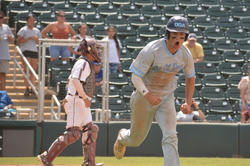 ODA senior Tanner Fairchild yells to the dugout after walking with the bases loaded in the seventh inning. The walk gave ODA the lead.