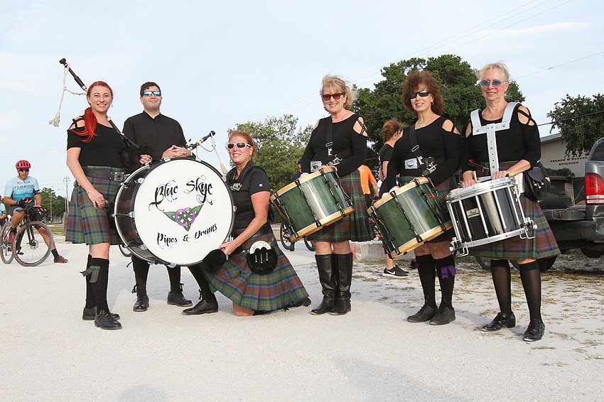 The Blue Skye Pipes and Drums group play music.