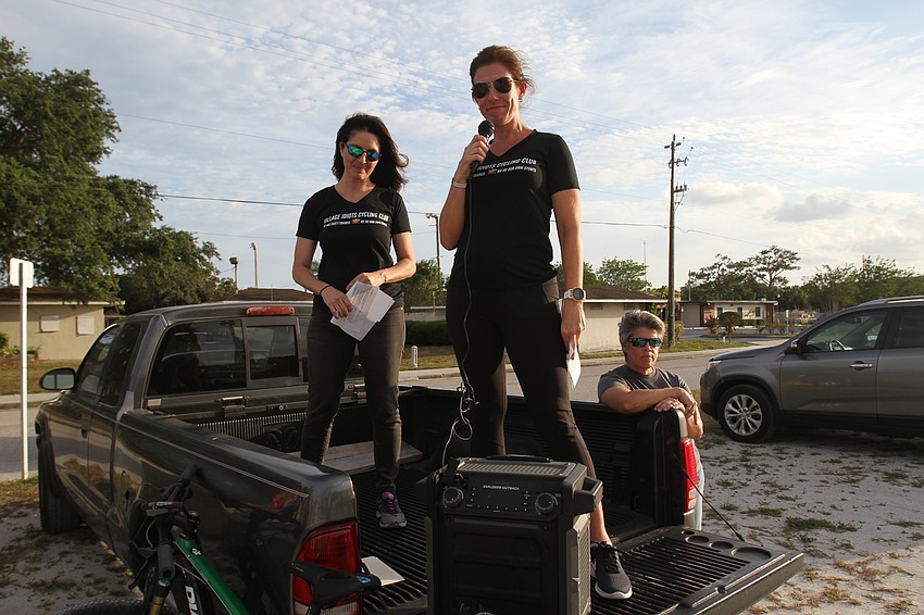 Vice president Lisa Michel and president Dawn Zielinski prepare tbe cyclists.