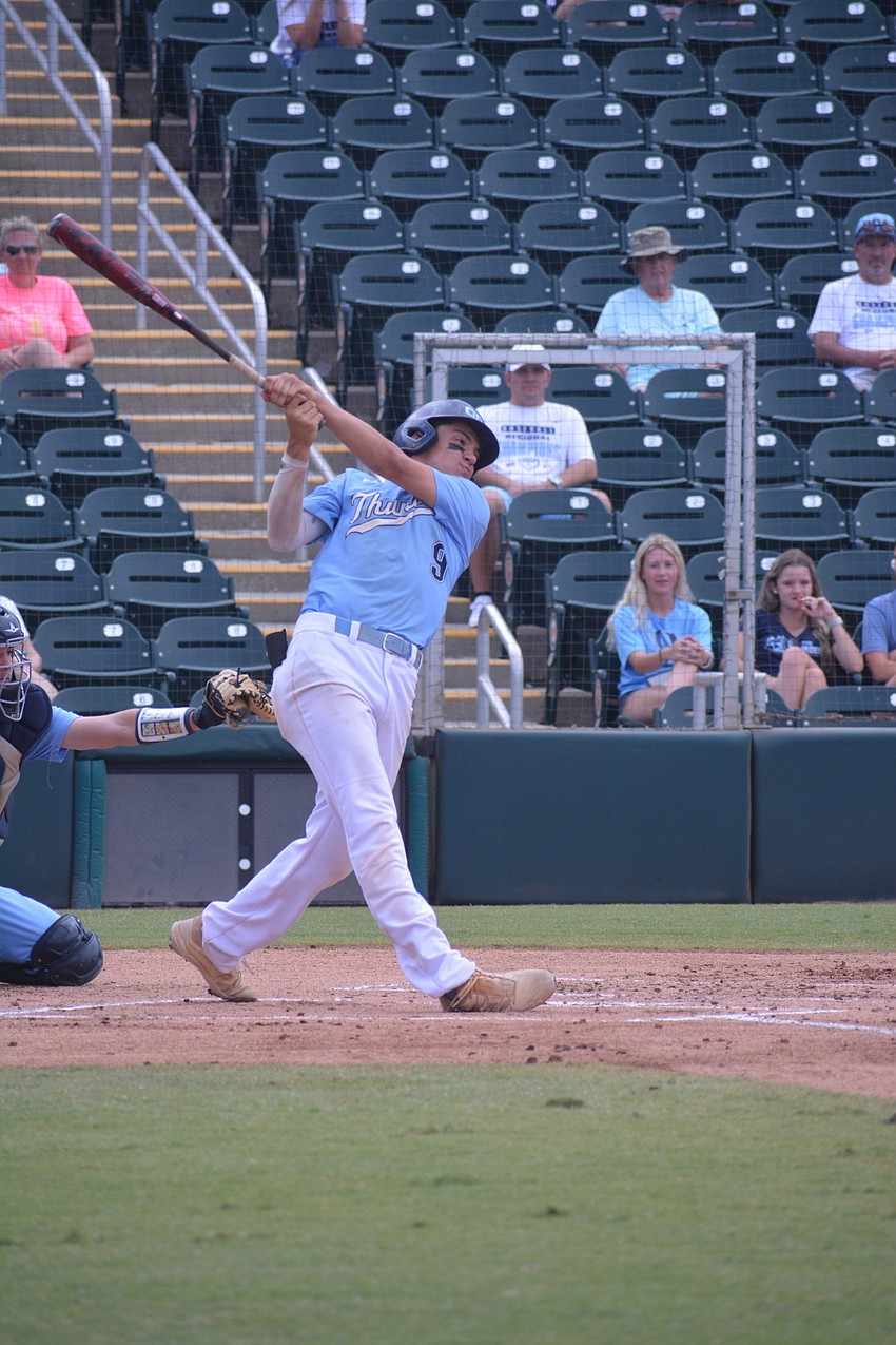 ODA senior Tanner Fairchild takes a big swing in the first inning.