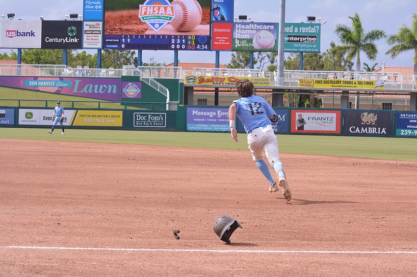 ODA senior PJ Fincher sprints to second base, helmet off, after an errant St. Johns throw to first base.