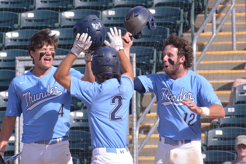 ODA junior Aidan Marino (2) gets greeted by seniors Ryan Kelly and PJ Fincher at the plate following a Marino home run.