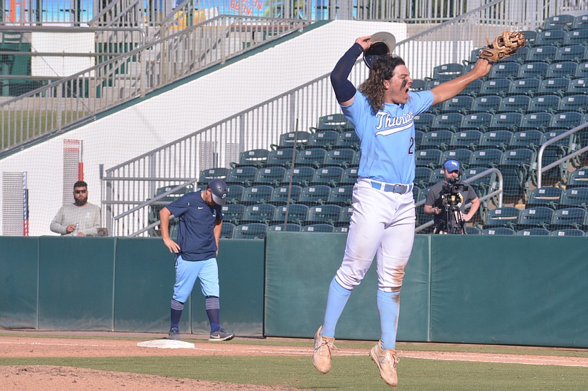 ODA senior Tyler Colditz throws his hat and glove after recording a strikeout to end the game and win the state title.