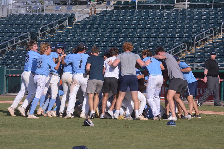 ODA dogpiles senior pitcher Tyler Colditz after he struck out the final St. Johns batter of the game to win the Class 2A state title.