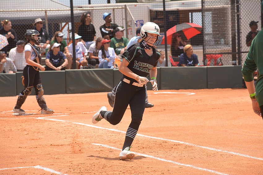 Lakewood Ranch sophomore Cassidy McLellan jogs around first base after hitting a leadoff home run.