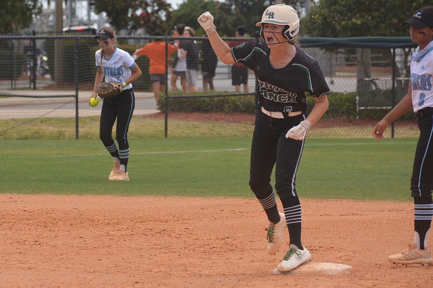 Lakewood Ranch junior Ella Coiner pumps her first after hitting an RBI double. Coiner was the team's pitcher Friday.