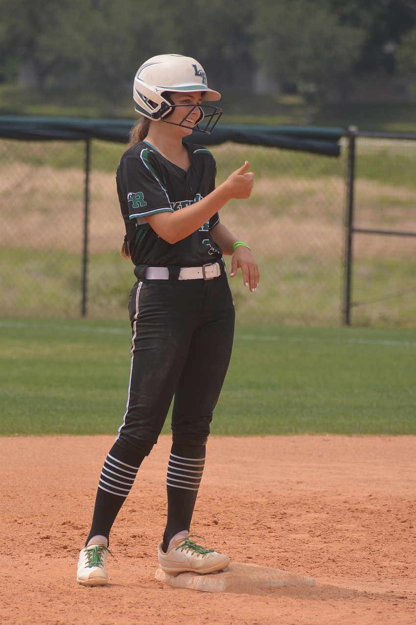 Lakewood Ranch junior Kelsey Vogel gives a thumbs up to Coach TJ Goelz after an RBI double in the fourth inning.