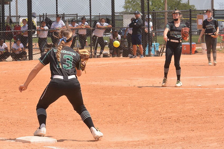 Lakewood Ranch junior Taylor Shepherd reaches to snag a throw from junior Ella Coiner for the first out of the fourth inning.