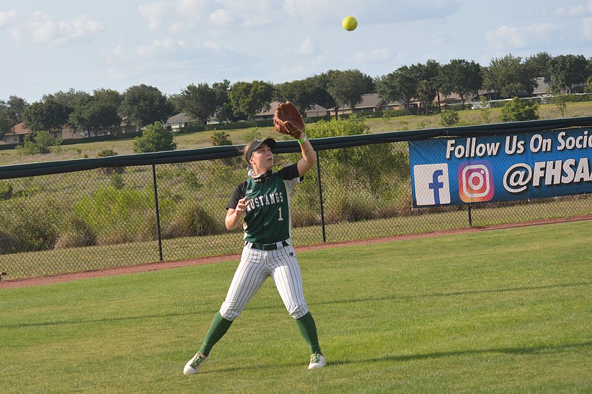 Lakewood Ranch senior Jillian Herbst catches a fly ball in left field.