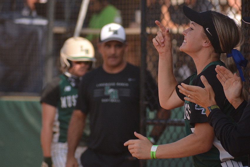 Lakewood Ranch freshman Grace Shaw-Rockey yells from the dugout in support of her teammates.
