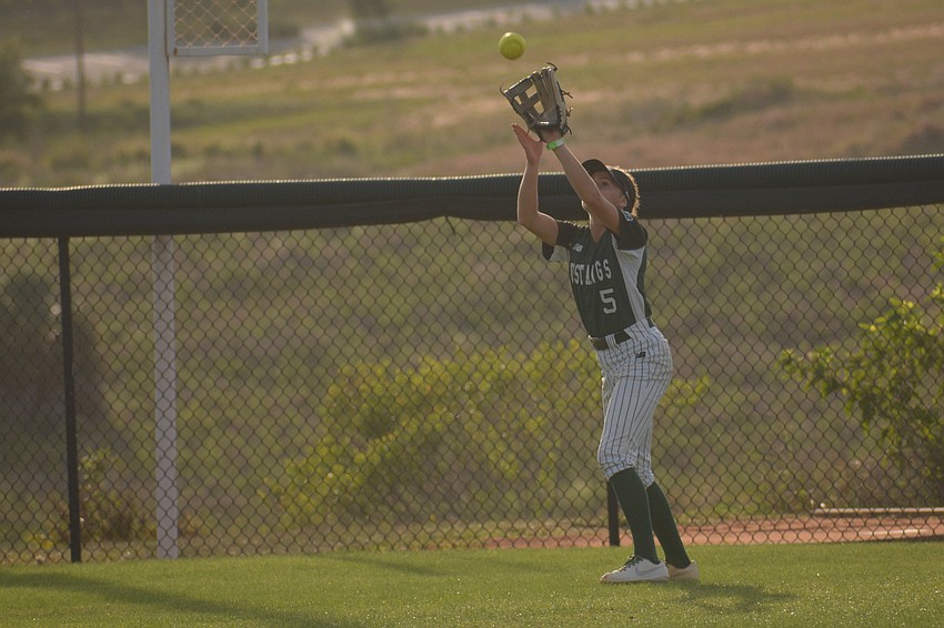Lakewood Ranch junior Ella Coiner catches a ball in left field.