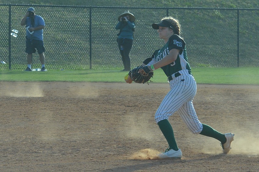 Lakewood Ranch junior Kelsey Vogel tosses a ball to first base for an out.