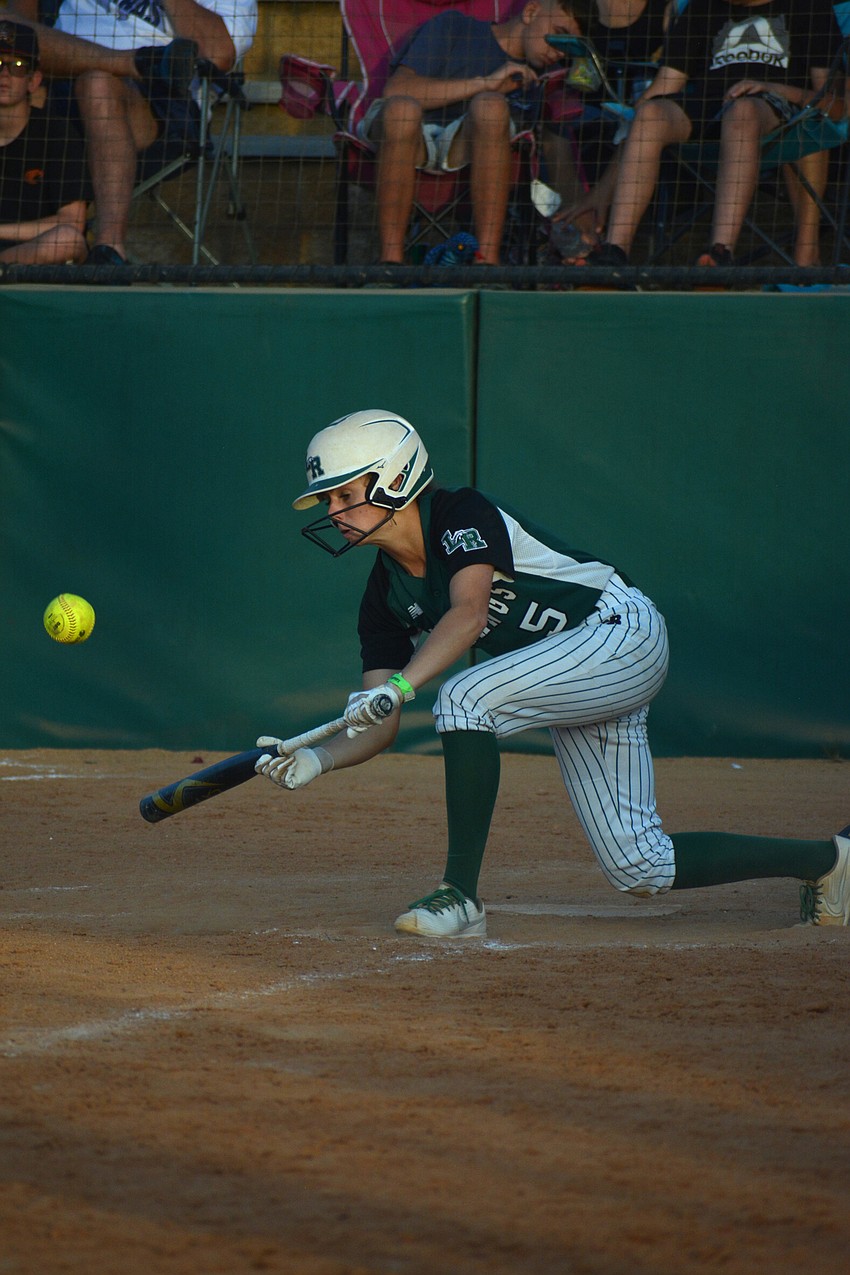 Lakewood Ranch junior Ella Coiner bunts for a base hit in the sixth inning.