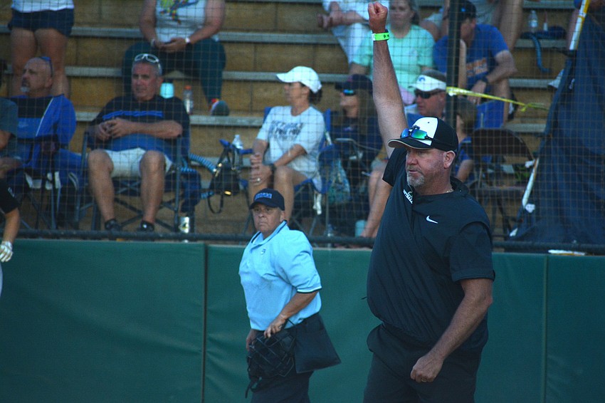 Lakewood Ranch Coach TJ Goelz waves home the winning runs in the sixth inning.
