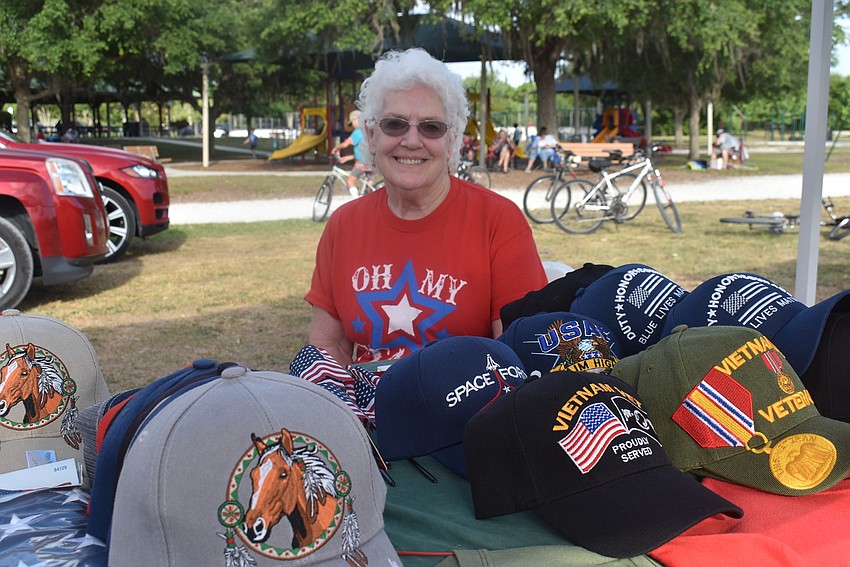 Carol Hamlett sells veterans hats, American flag-themed merchandise and more. She was invited to the concert by Lakewood Ranch from Palmetto.