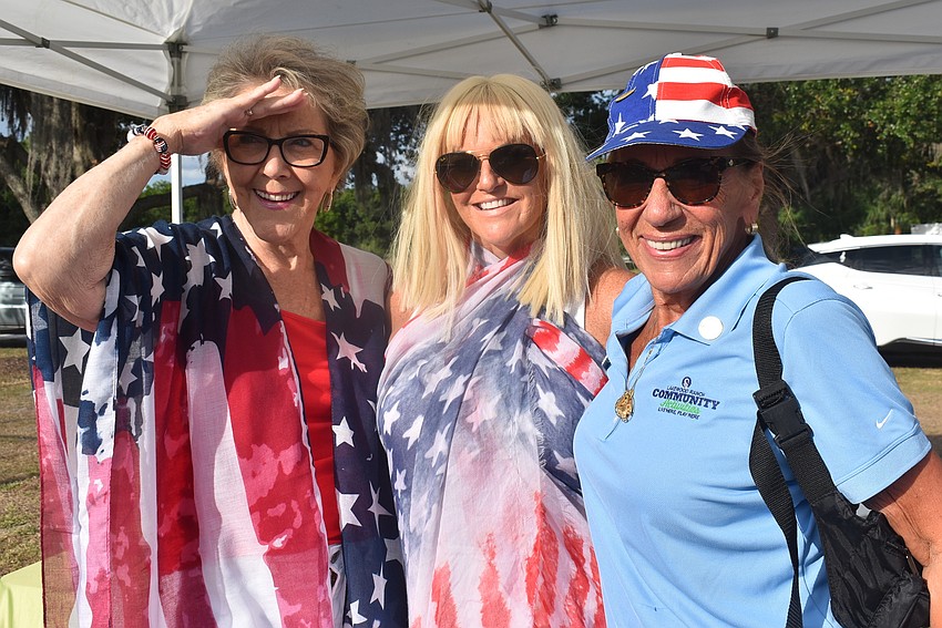 Greenbrook's Evelyn Turner, Michelle Sampson, public relations director for Cool Today, one of the event's major sponsors, and Lakewood Ranch Community Activities Vice President Carlene Smith. Turner's husband, Ron, is a veteran.