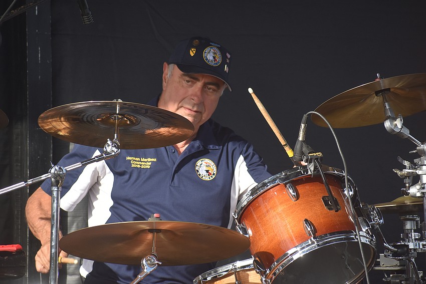 U.S. Army and Vietnam War veteran Herman Martinez plays the drums while on stage with Bradenton-based band Whiskey Blind. Martinez founded the Del Webb Association of Veterans and Military Supporters.