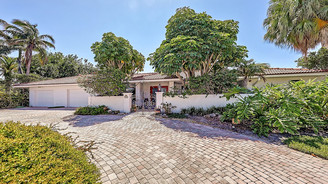 The home at 122 Seagull Lane on Bird Key  was built in 1977. It has a pool, three bedrooms, three-and-a-half baths and 3,776 square feet of living space.