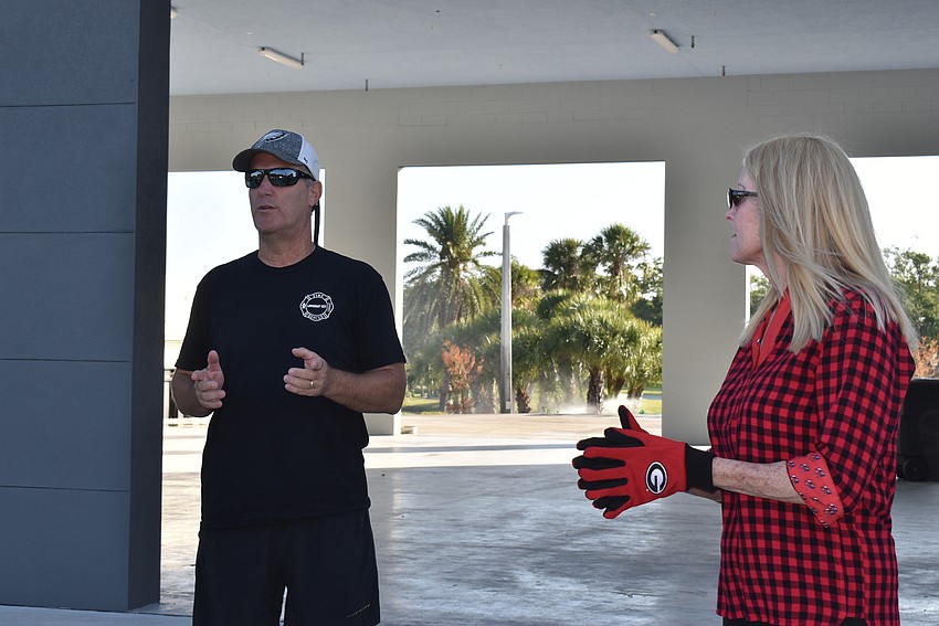 Paul Dezzi addresses the club as Susan Phillips stands by.