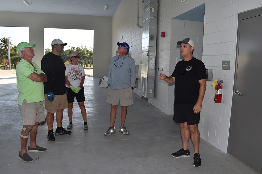 Paul Dezzi leads the club into the firehouse.