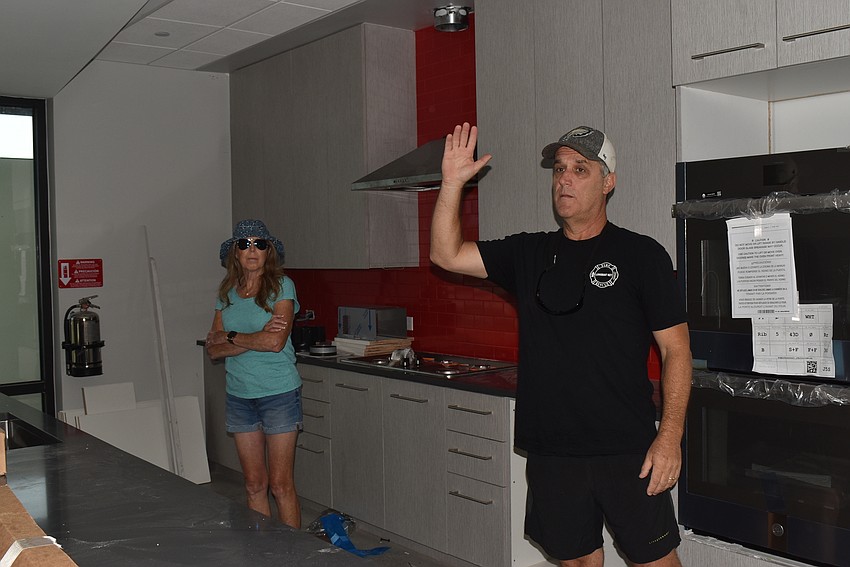 Paul Dezzi shows the kitchen.