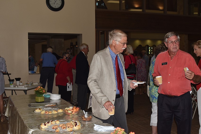 Paul Rake and Andy Sawyer chat after getting treats.