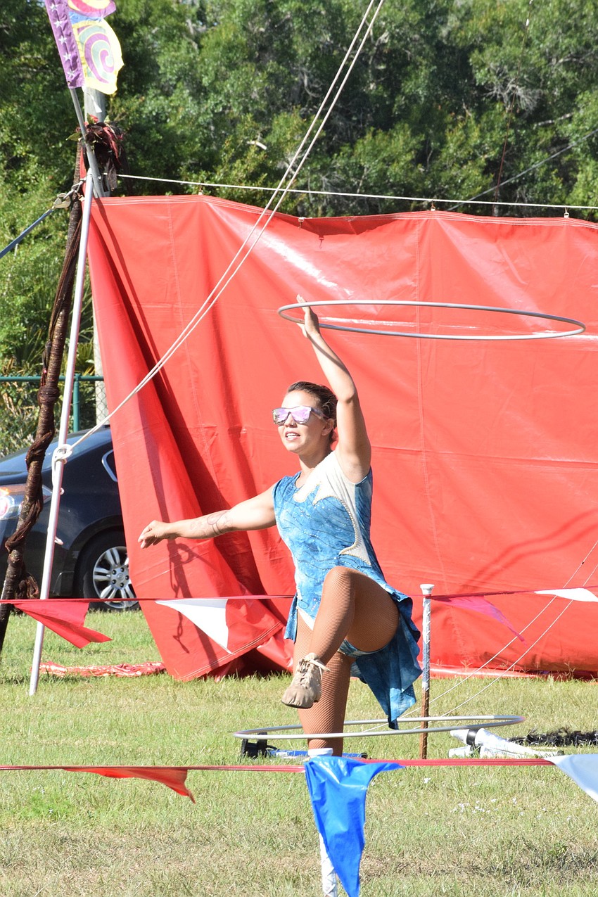 Mercedes Pages with Circus on the Ranch dazzles the crowd while performing with two hula hoops.