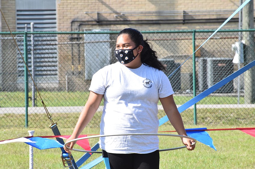 Cryztal Hernandez, a fifth grader, prepares to start the hula hoop contest against three other fifth graders.