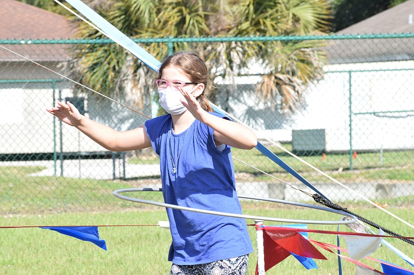 Khloe Lovett, a fifth grader, is the student to hula hoop the longest. She was declared the winner of the hula hoop contest.