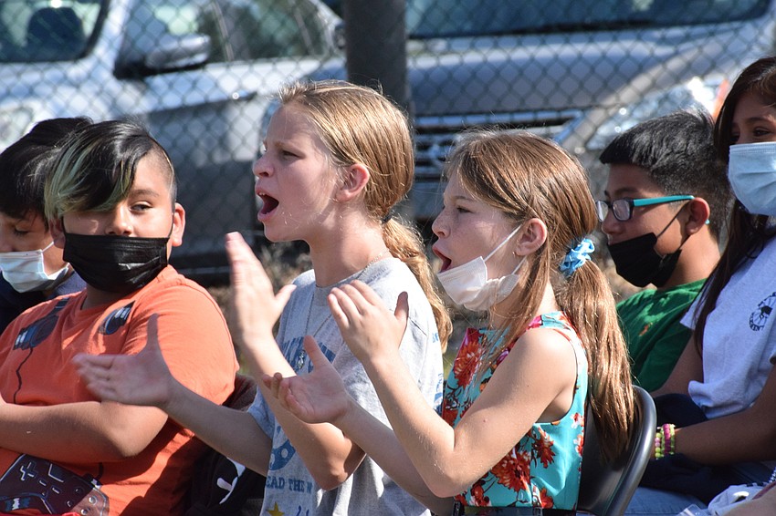 Fifth graders Suriel Luis Martinez, Kaitlyn Peterson and Bella Reed cheer for their friend in the hula hoop contest.