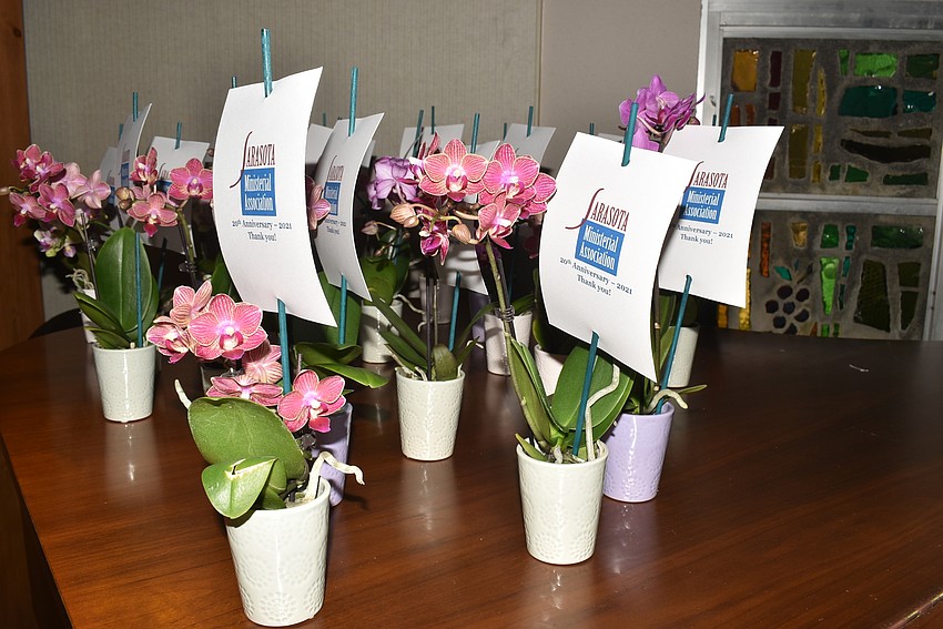 Board members gave out orchids to honored guests throughout the meeting.