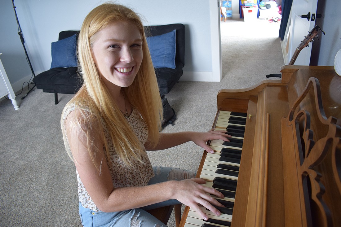 Kaitlyn Hornung says she still loves the half-century old Wurlitzer piano that has been passed down through her family.