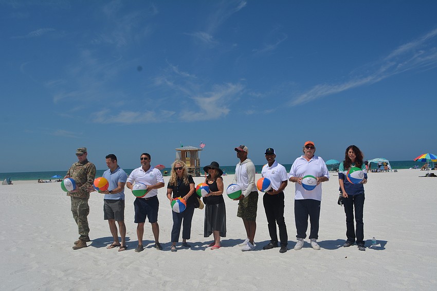 The first wave of ceremonial beach-ball-batters gathered together prior to the big moment.