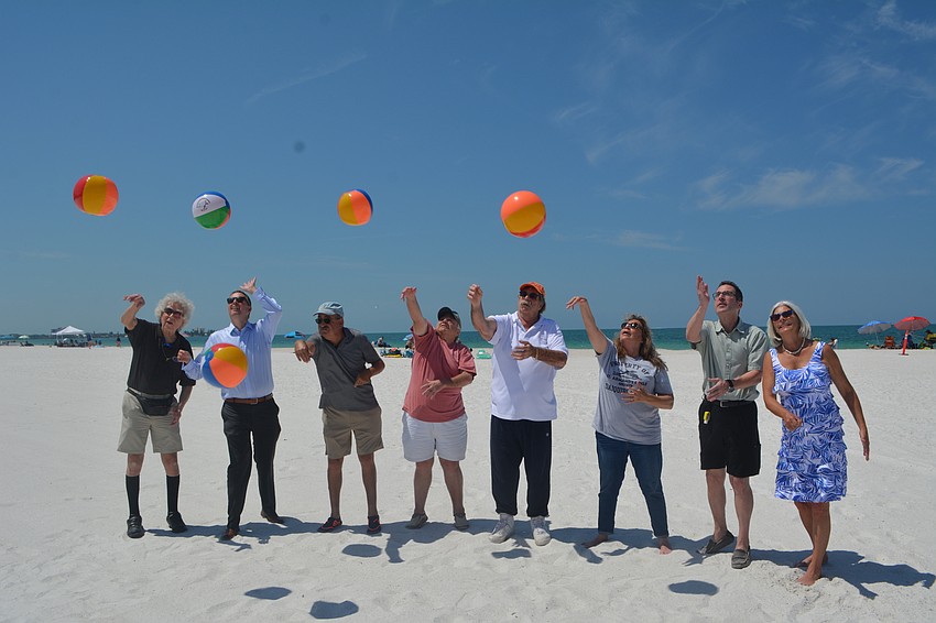 A group of Lido Key residents also partook in the celebratory beach ball batting.