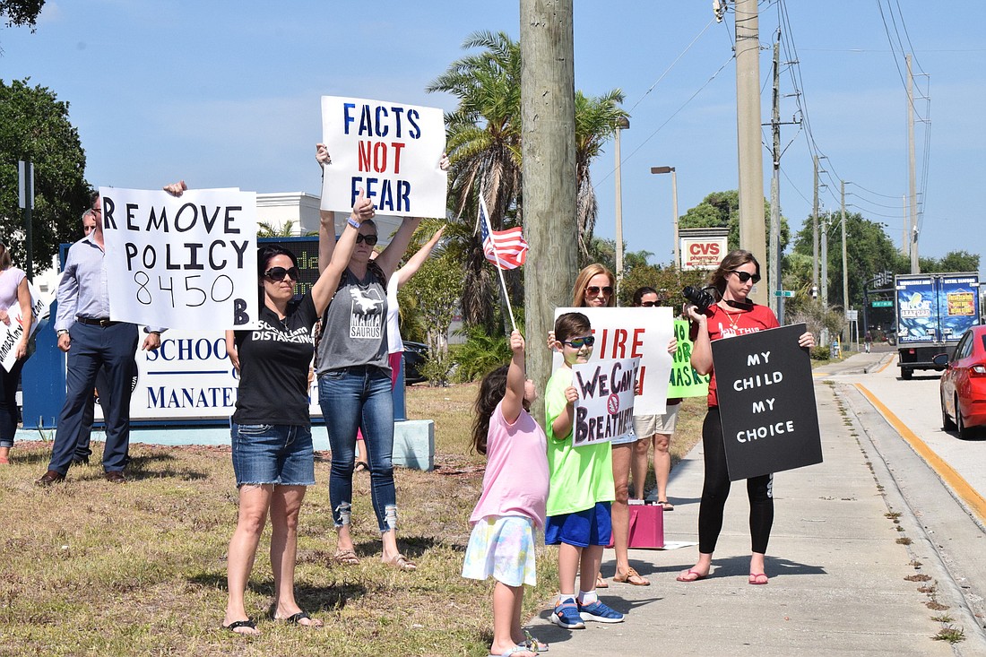 School District of Manatee County families and Manatee County residents protest the school district&#39;s mask mandate before the School Board of Manatee County&#39;s meeting.