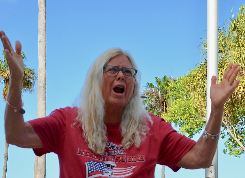 Jan Hamel Solomon delivers a prayer to the gathered participants before they headed out on their 5K route.