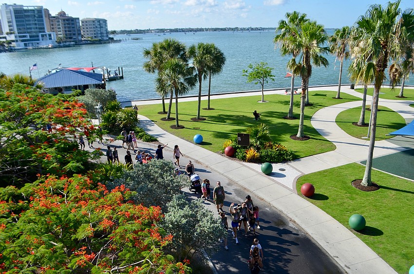 Hikers make their way through Hart's Landing on their way to the westbound side of the John Ringling Bridge.