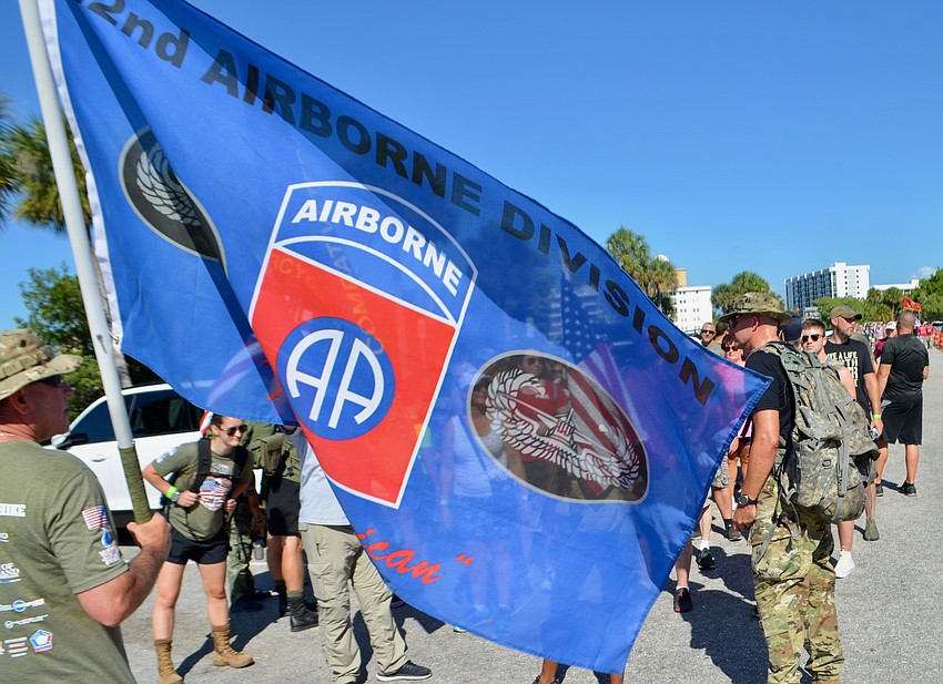 The Army group of hikers assembles in the Marina Jack parking lot before crossing Bayfront Drive on the return leg.