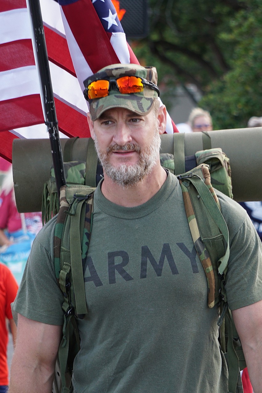 U.S. Rep. Greg Steube (R-Sarasota) is an Army veteran and led Saturday's hike carrying military pack.