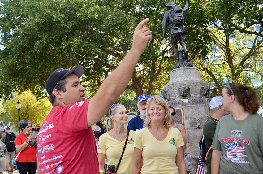 Bill Sterbinsky addresses the gathered crowd on the hike's route and safety concerns.