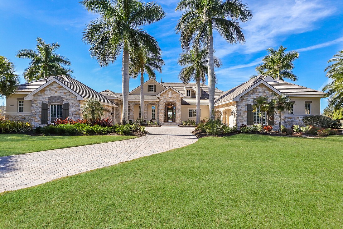 Philip and Susan Morris sold their home at 16006 Foremast Place in the Lake Club to Tryn and Cindy Stimart, of Lakewood Ranch, for $3.6 million. Photo courtesy of Realtor Barbara Najmy.