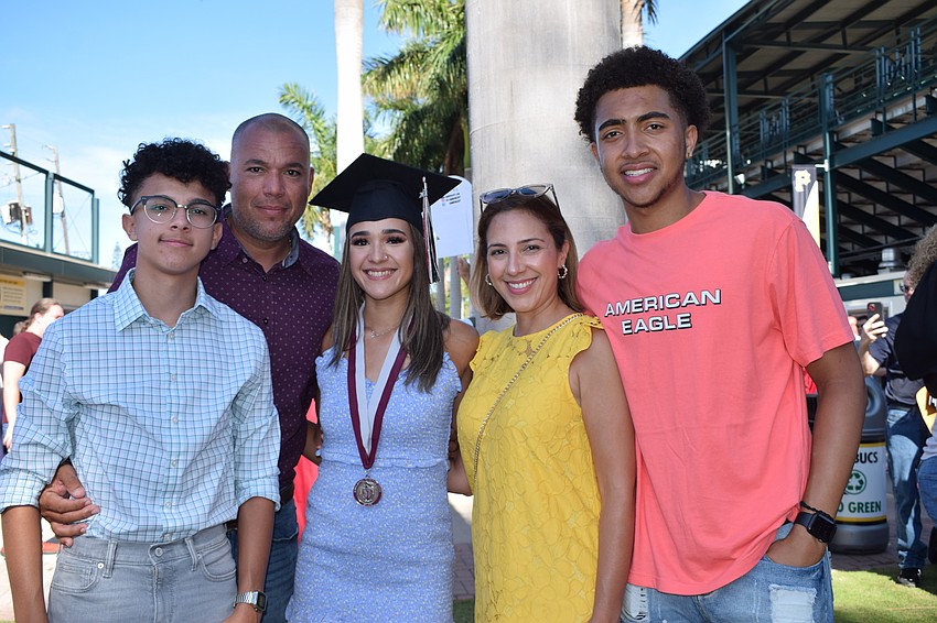 Sebastian Garcia, Juan Garcia, Andrea Garcia Marzan, Naidine Marzan and Xavier Williams commemorate Andrea Garcia Marzan's graduation from high school.