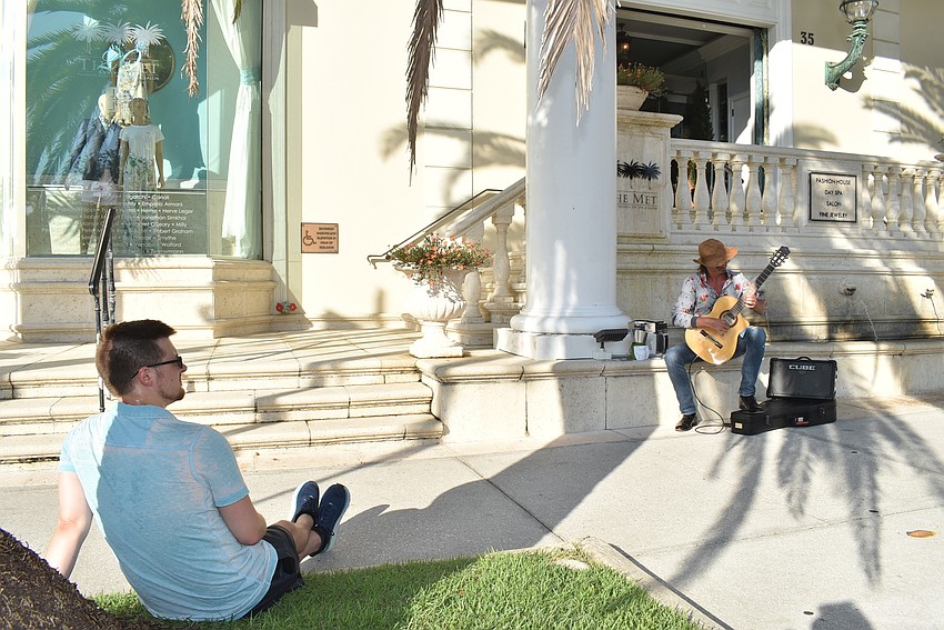 Jesse Lippert played guitar while Josh Proctor watched.