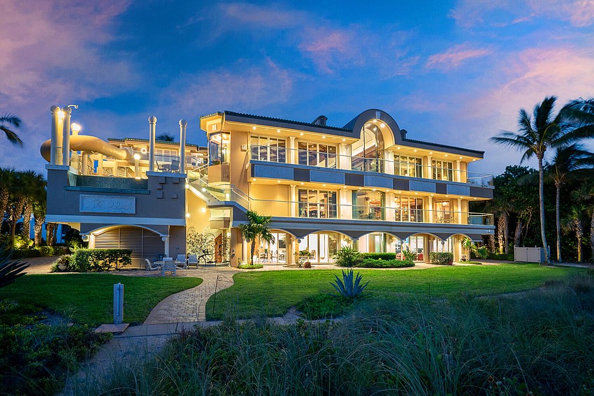 The beachfront pool, left, is on the home's main level, one up from the ground floor.
